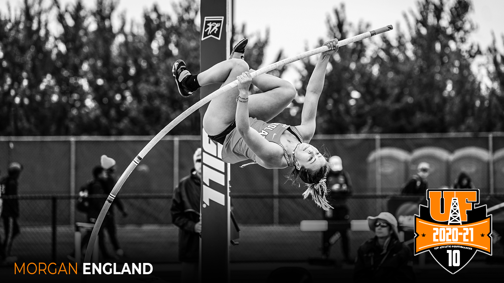 women's pole vaulter launching into the air